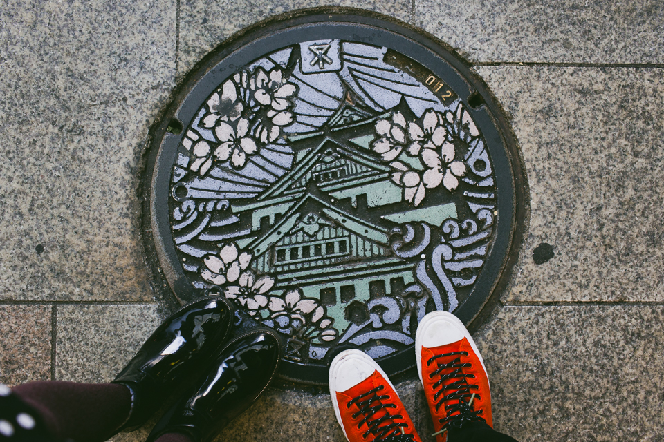 Osaka castle manhole - The cat, you and us